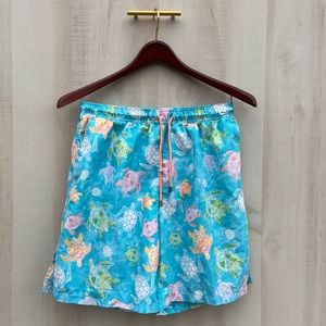 Peter Millar swim shorts. Light blue with sea turtle design.